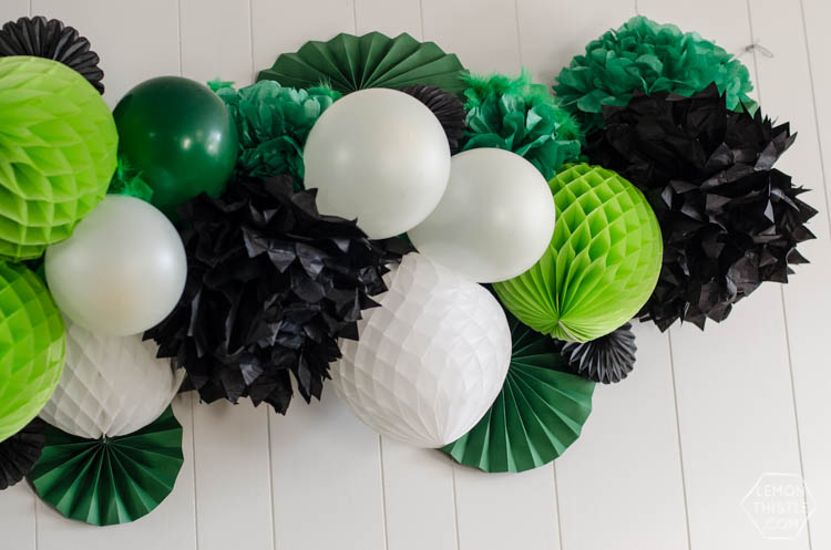 How to build a giant party garland using balloons, paper fans and feather boas