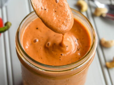 Dive into this Creamy Roasted Red Pepper Soup! With the delicious flavours of roasted red peppers, tomatoes, and made creamy with cashews, this soup is the ultimate cold weather lunch or dinner!