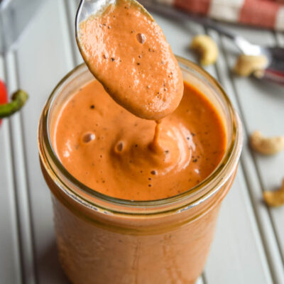 Dive into this Creamy Roasted Red Pepper Soup! With the delicious flavours of roasted red peppers, tomatoes, and made creamy with cashews, this soup is the ultimate cold weather lunch or dinner!