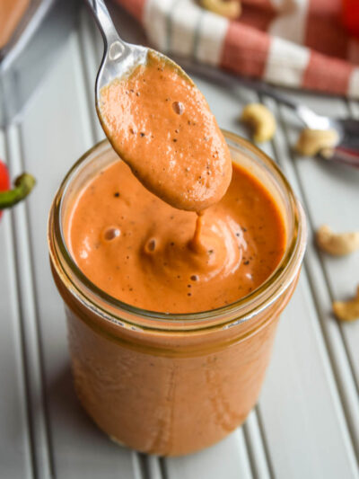 Dive into this Creamy Roasted Red Pepper Soup! With the delicious flavours of roasted red peppers, tomatoes, and made creamy with cashews, this soup is the ultimate cold weather lunch or dinner!