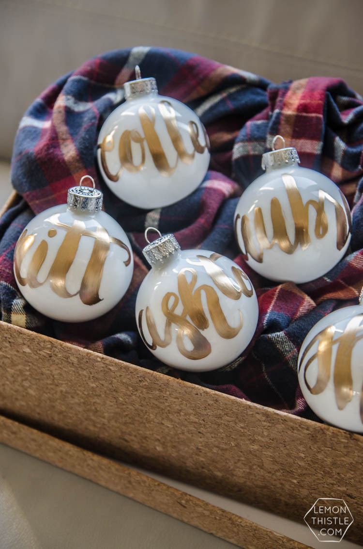 DIY Hand Lettered Ornaments- these would make great gifts for Christmas with the person's name!