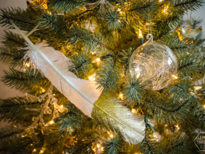 DIY gilded and glittered feather gift toppers... these would make cute christmas ornaments too!