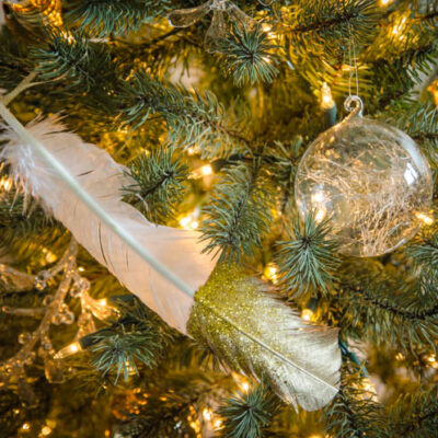 DIY gilded and glittered feather gift toppers... these would make cute christmas ornaments too!