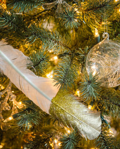 DIY gilded and glittered feather gift toppers... these would make cute christmas ornaments too!