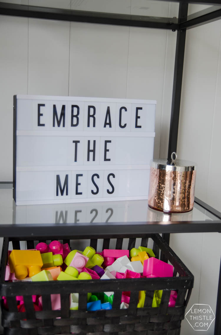 Styling a bookcase with kids. YES! Just because you have kids doesn't mean you can't have nice things.