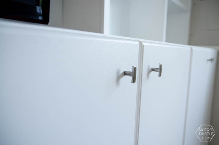 Assembly of built in cabinets for TV and storage- click through for full tutorial