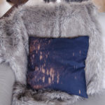 I love this pillow- such an easy DIY to spray navy fabric with bleach!
