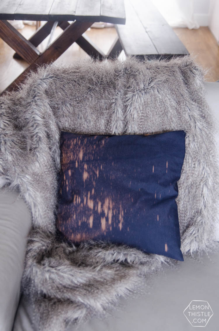 I love this pillow- such an easy DIY to spray navy fabric with bleach!