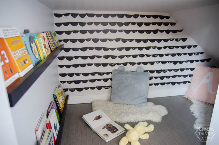 An under stairs nook for kids to play! I love the hand stamped 'wallpaper'. Click through for full tutorial