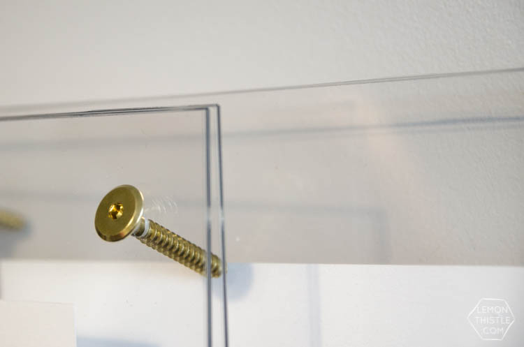 DIY brass and acrylic floating frames- for a fraction of the cost! So modern, I love it!