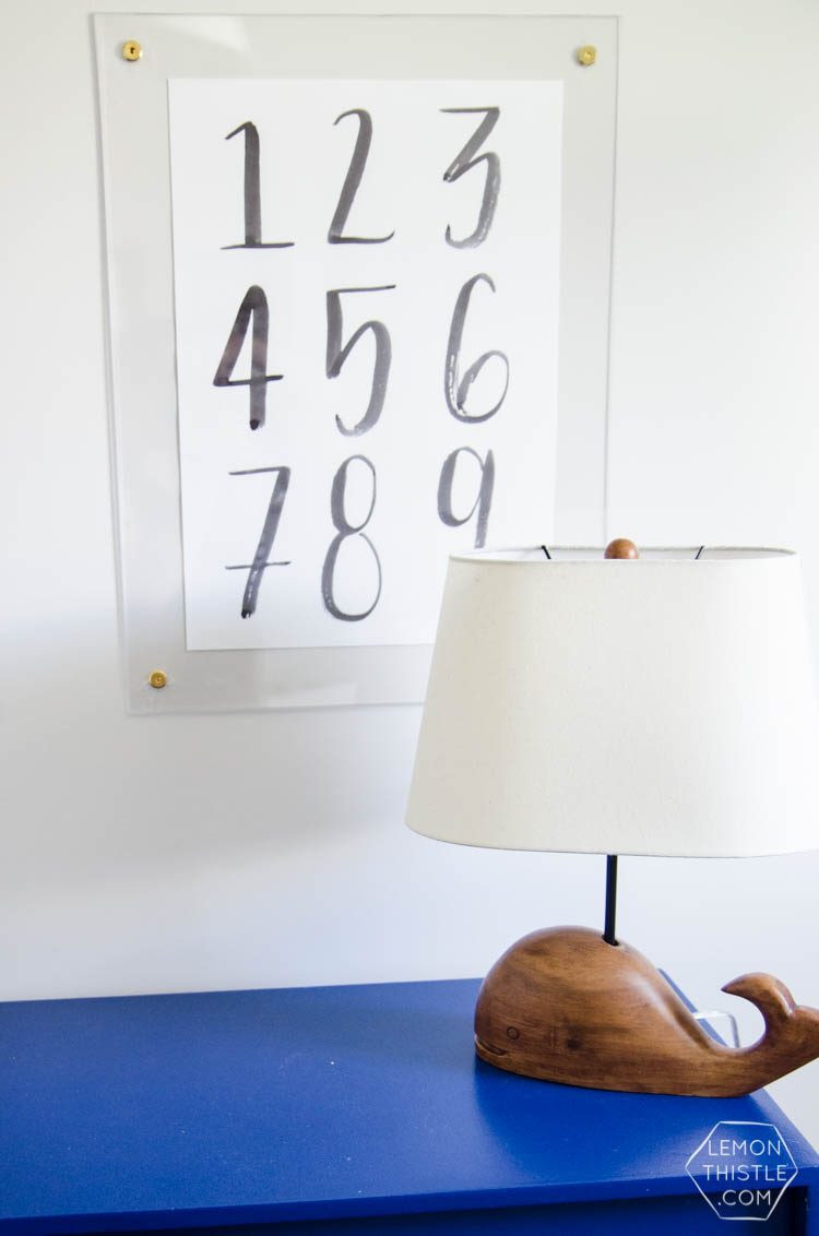 DIY brass and acrylic floating frames- for a fraction of the cost! So modern, I love it!