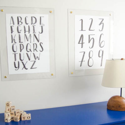 DIY brass and acrylic floating frames- for a fraction of the cost! So modern, I love it!