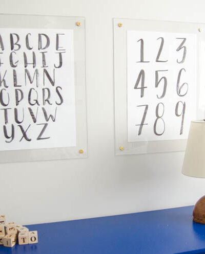 DIY brass and acrylic floating frames- for a fraction of the cost! So modern, I love it!