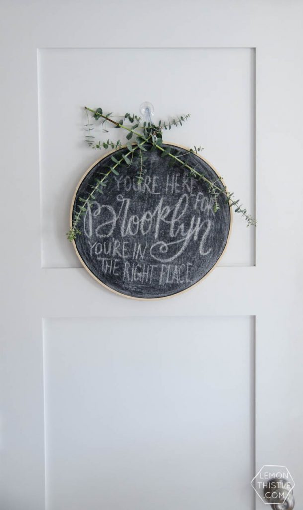 DIY hoop chalkboard for a baby shower welcome sign