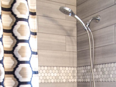 DIY Bathroom Renovation- I love that it breaks it down into stages! I've always wondered if I could renovate in phases. Everything is DIY too, from the tile to the shelf!