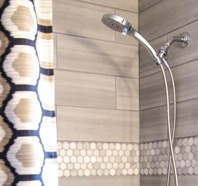 DIY Bathroom Renovation- I love that it breaks it down into stages! I've always wondered if I could renovate in phases. Everything is DIY too, from the tile to the shelf!