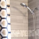 DIY Bathroom Renovation- I love that it breaks it down into stages! I've always wondered if I could renovate in phases. Everything is DIY too, from the tile to the shelf!