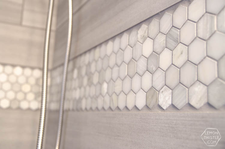 DIY Bathroom Renovation- I love that it breaks it down into stages! I've always wondered if I could renovate in phases. Everything is DIY too, from the tile to the shelf!