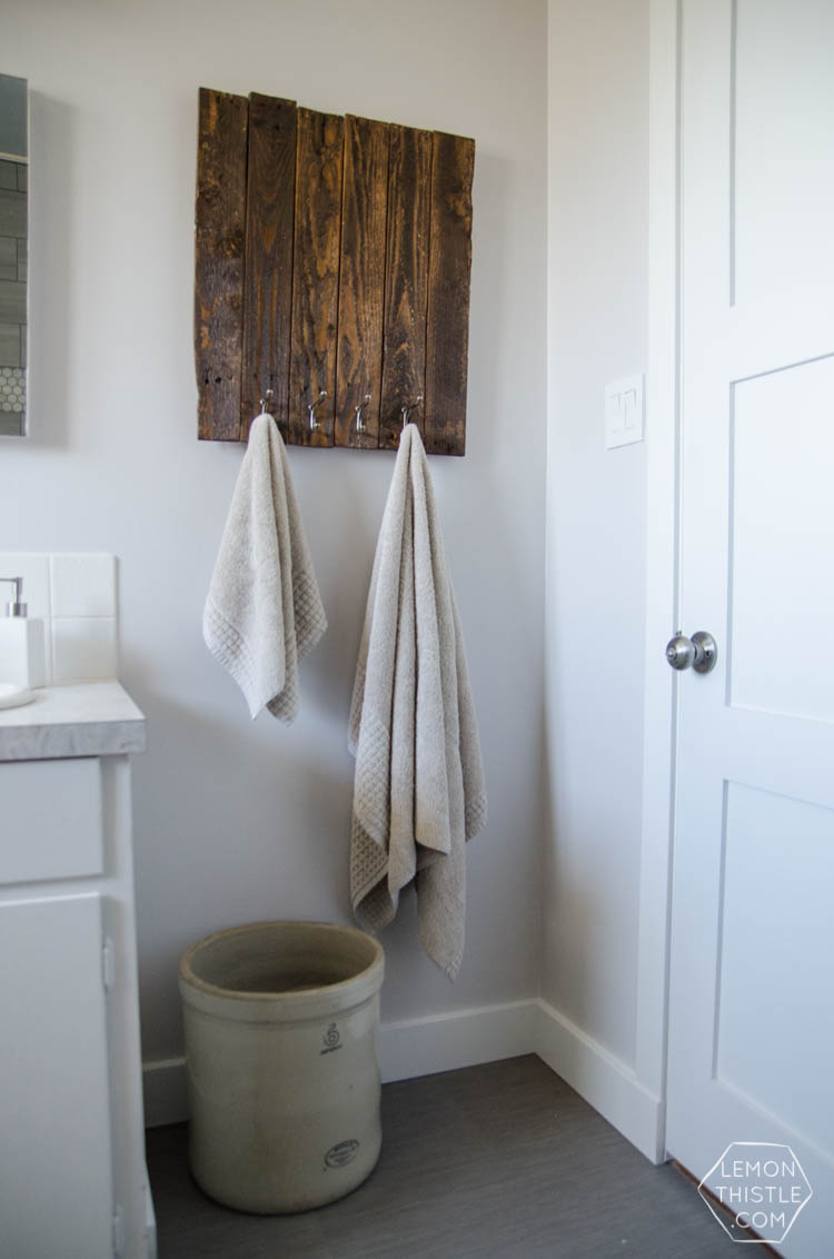 DIY Bathroom Renovation- I love that it breaks it down into stages! I've always wondered if I could renovate in phases. Everything is DIY too, from the tile to the shelf!