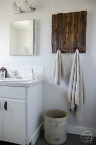 DIY Bathroom Renovation- I love that it breaks it down into stages! I've always wondered if I could renovate in phases. Everything is DIY too, from the tile to the shelf!
