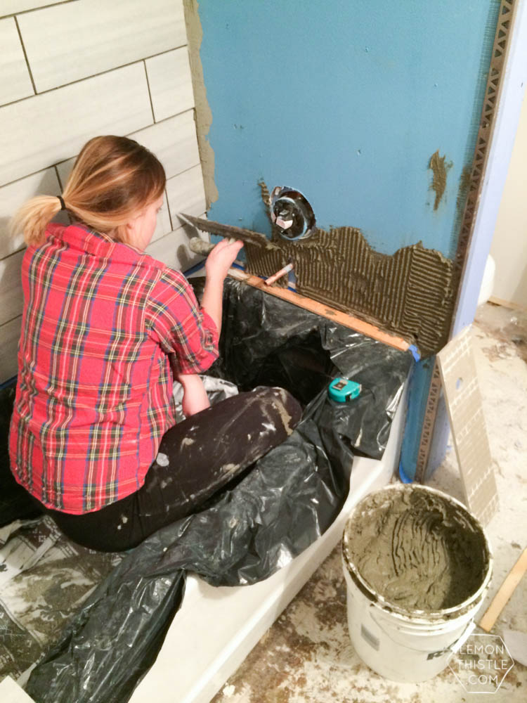 DIY Bathroom Renovation- I love that it breaks it down into stages! I've always wondered if I could renovate in phases. Everything is DIY too, from the tile to the shelf!