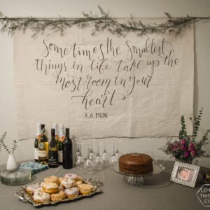 I LOVE this DIY giant canvas backdrop for a party... or a nursery. The hand lettering and floral garland is gorgeous! Plus, such great tips to paint thin lines on fabric.