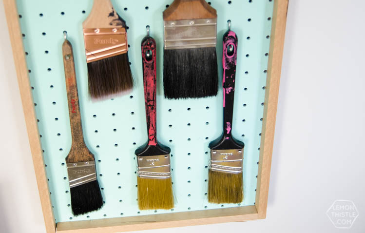 DIY Paintbrush storage board using pegboard- I love this idea! Plus the kids brushes are so smart