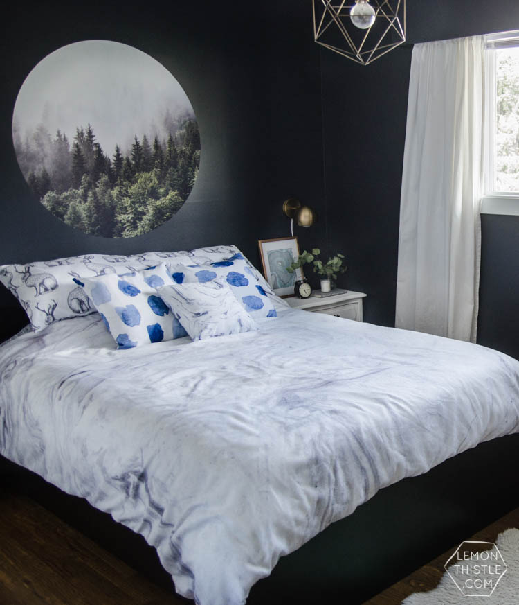I LOVE this moody navy bedroom- the forrest, the gallery wall- the brass lights... it's all so good! And I love all the DIY