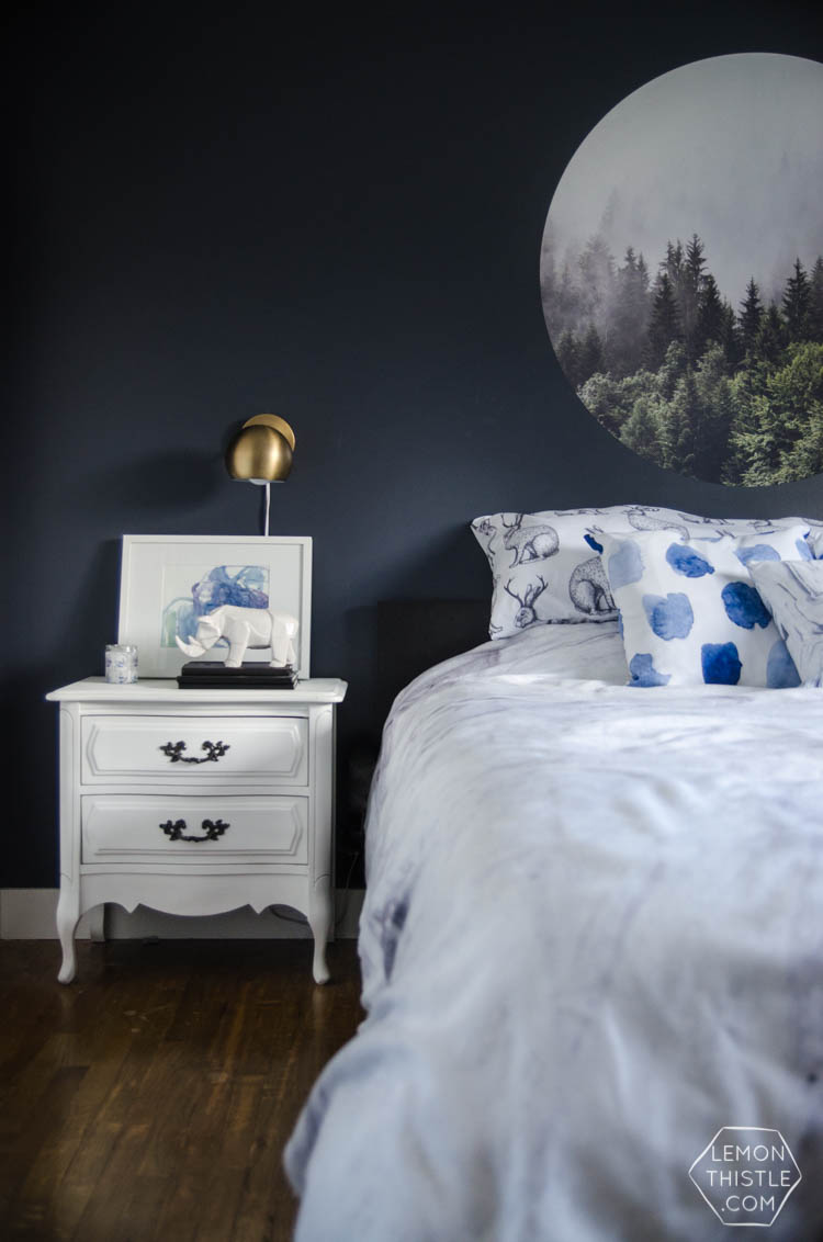 I LOVE this moody navy bedroom- the forrest, the gallery wall- the brass lights... it's all so good! And I love all the DIY