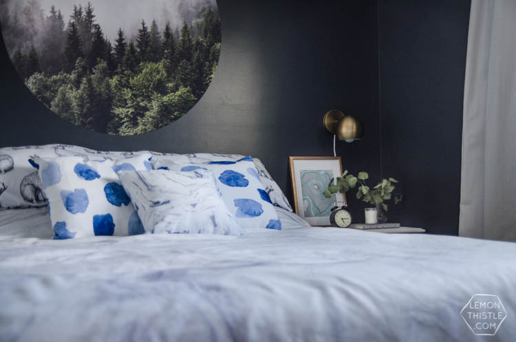 I LOVE this moody navy bedroom- the forrest, the gallery wall- the brass lights... it's all so good! And I love all the DIY