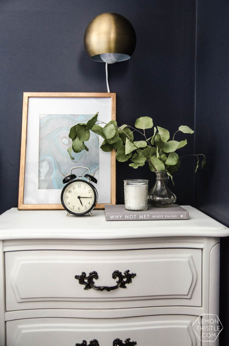 I LOVE this moody navy bedroom- the forrest, the gallery wall- the brass lights... it's all so good! And I love all the DIY