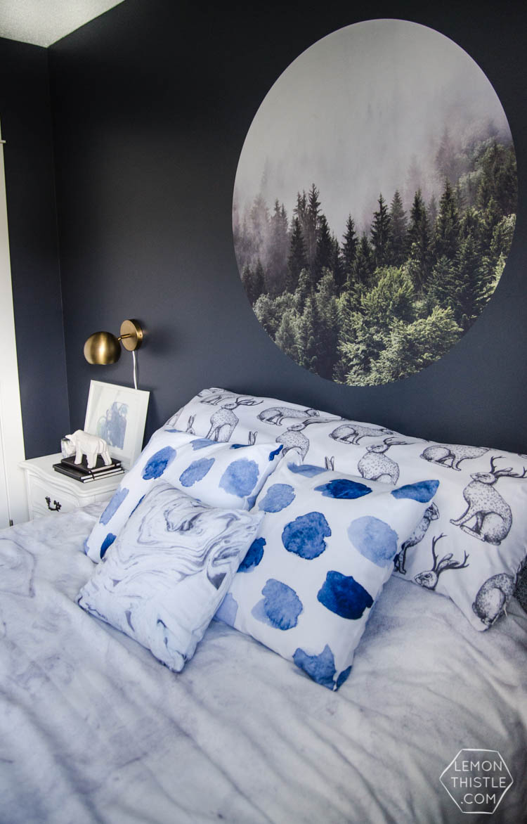 I LOVE this moody navy bedroom- the forrest, the gallery wall- the brass lights... it's all so good! And I love all the DIY