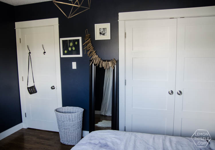 I LOVE this moody navy bedroom- the forrest, the gallery wall- the brass lights... it's all so good! And I love all the DIY