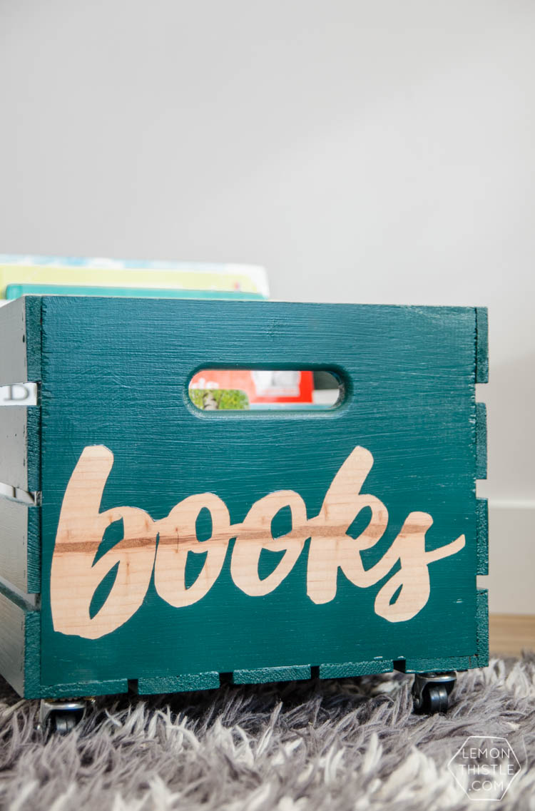 DIY rolling book crate- I love that stencilled label! The natural wood looks so great