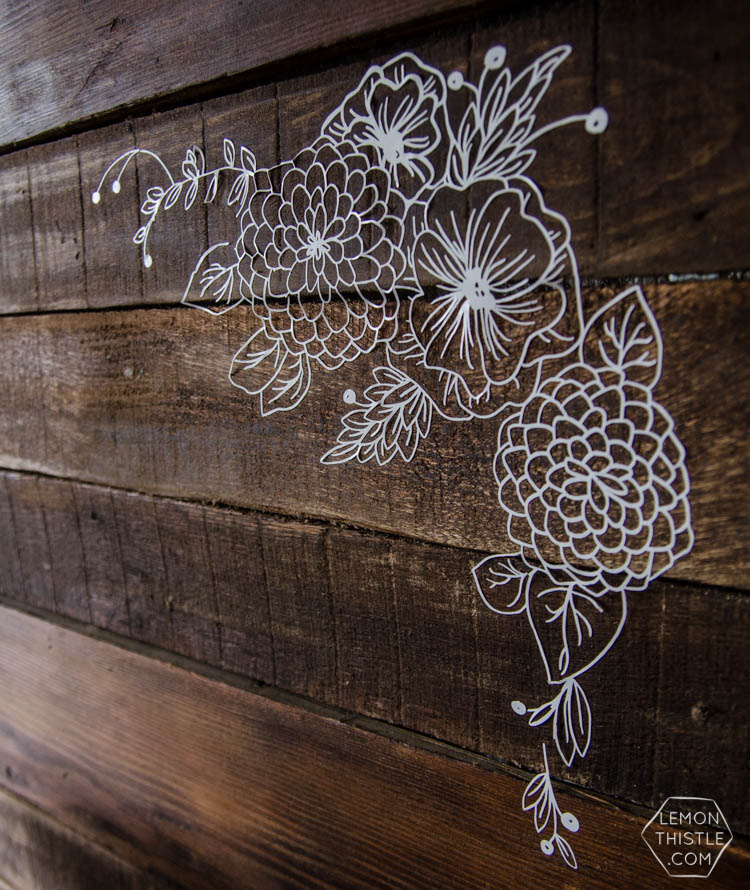I LOVE this floral rustic backdrop- it's so perfect for a wedding or photo booth... it's so intricate, I can't believe it isn't drawn on there