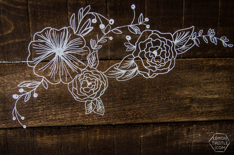 I LOVE this floral rustic backdrop- it's so perfect for a wedding or photo booth... it's so intricate, I can't believe it isn't drawn on there
