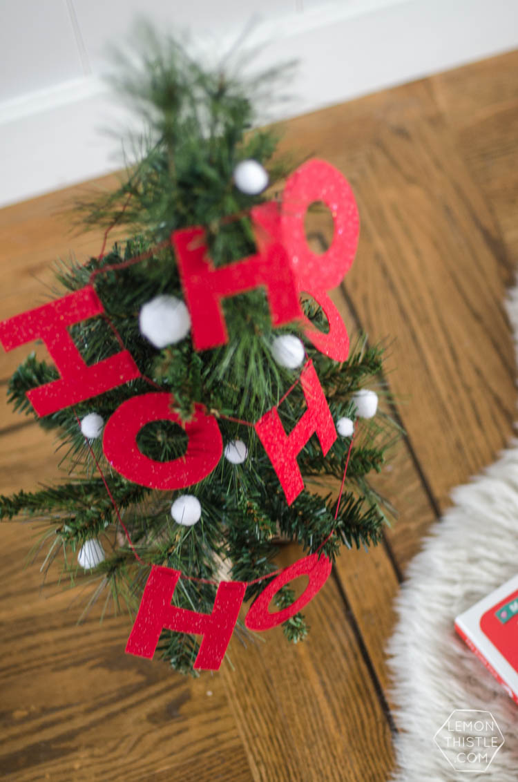 I love this DIY Christmas garland! The modern felt letters are perfect- and the pom pom is a cute detail!