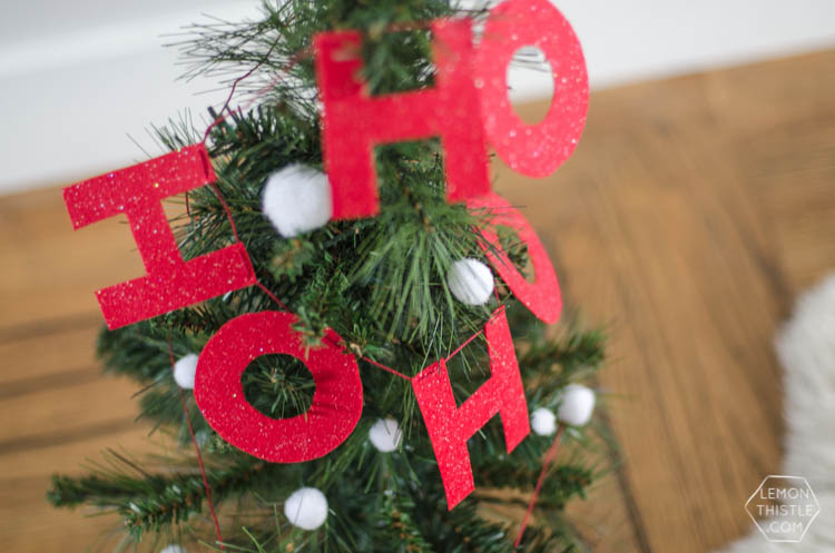 I love this DIY Christmas garland! The modern felt letters are perfect- and the pom pom is a cute detail!