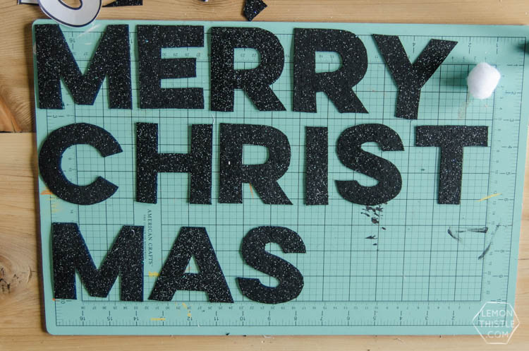 I love this DIY Christmas garland! The modern felt letters are perfect- and the pom pom is a cute detail!