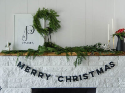 I love this DIY Christmas garland! The modern felt letters are perfect- and the pom pom is a cute detail!