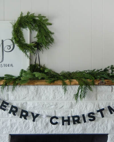 I love this DIY Christmas garland! The modern felt letters are perfect- and the pom pom is a cute detail!