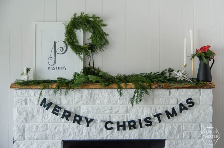 I love this DIY Christmas garland! The modern felt letters are perfect- and the pom pom is a cute detail!