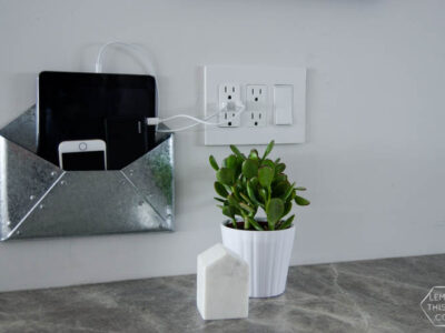 DIY Wall Mounted Charging Station- I love that this doesn't clutter up any counter space - the USB plug is perfect!