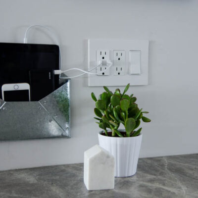 DIY Wall Mounted Charging Station- I love that this doesn't clutter up any counter space - the USB plug is perfect!