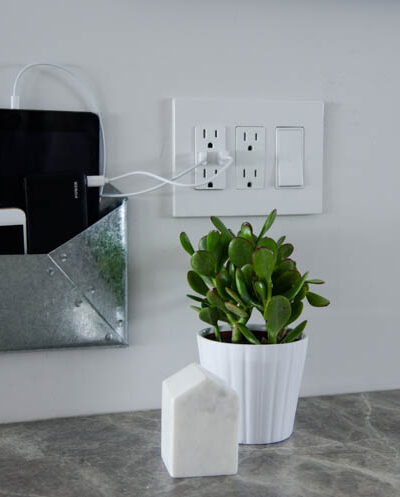 DIY Wall Mounted Charging Station- I love that this doesn't clutter up any counter space - the USB plug is perfect!