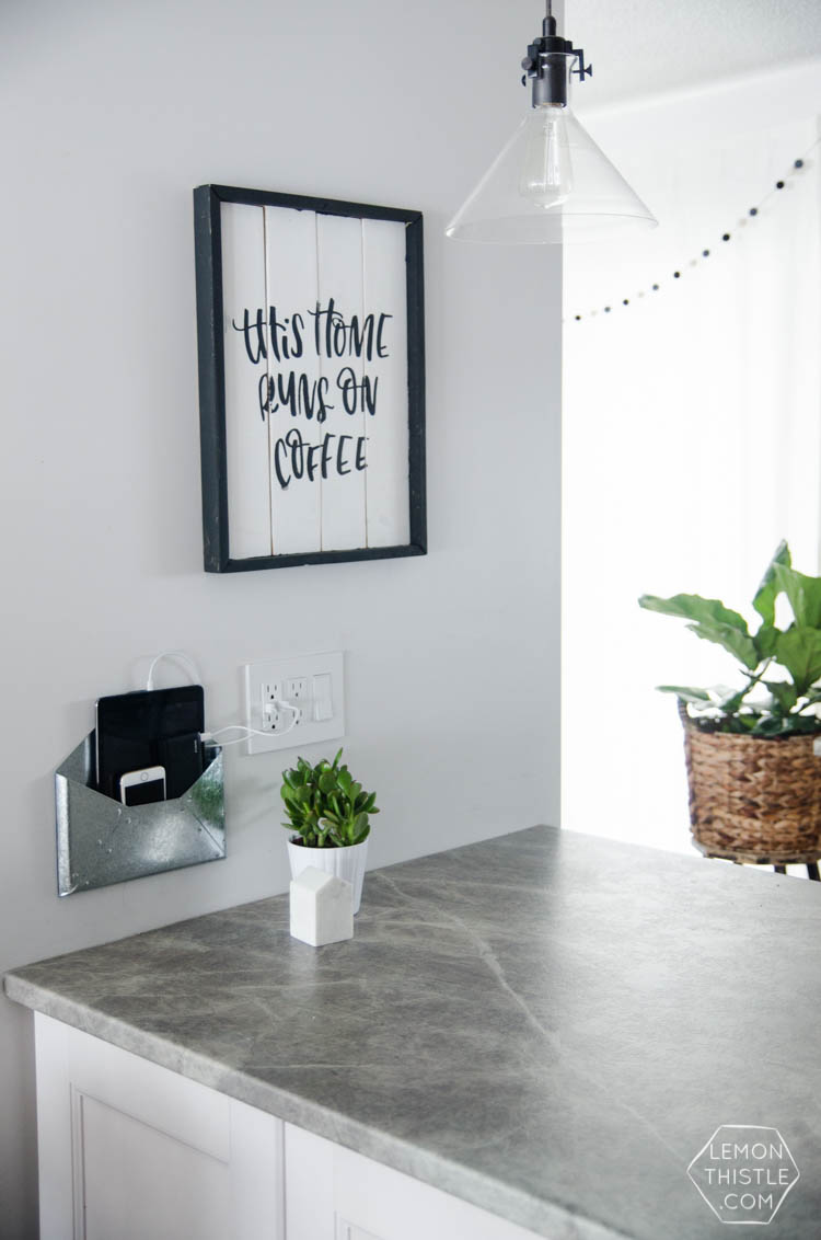 DIY Wall Mounted Charging Station- I love that this doesn't clutter up any counter space - the USB plug is perfect!