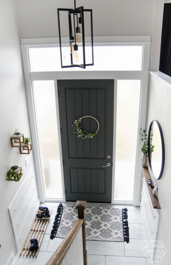 DIY Split Level Entry Makeover- I LOVE this entry. The oversize door, scandi influence and that shoe storage!
