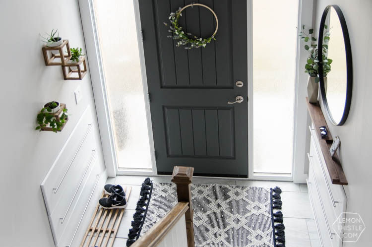 DIY Split Level Entry Makeover- I LOVE this entry. The oversize door, scandi influence and that shoe storage!