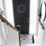 DIY Split Level Entry Makeover- I LOVE this entry. The oversize door, scandi influence and that shoe storage!