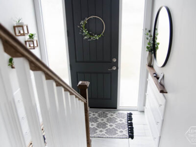 DIY Split Level Entry Makeover- I LOVE this entry. The oversize door, scandi influence and that shoe storage!